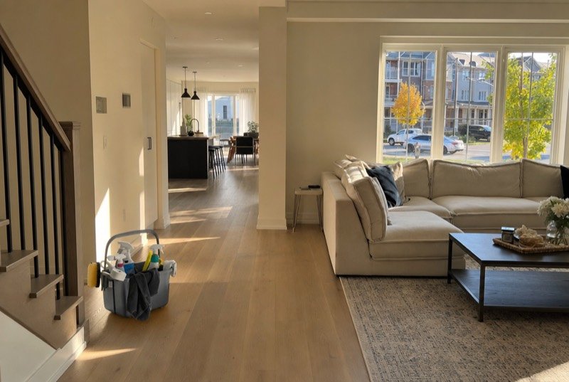 A spotless, bright open-concept living room staged for showings